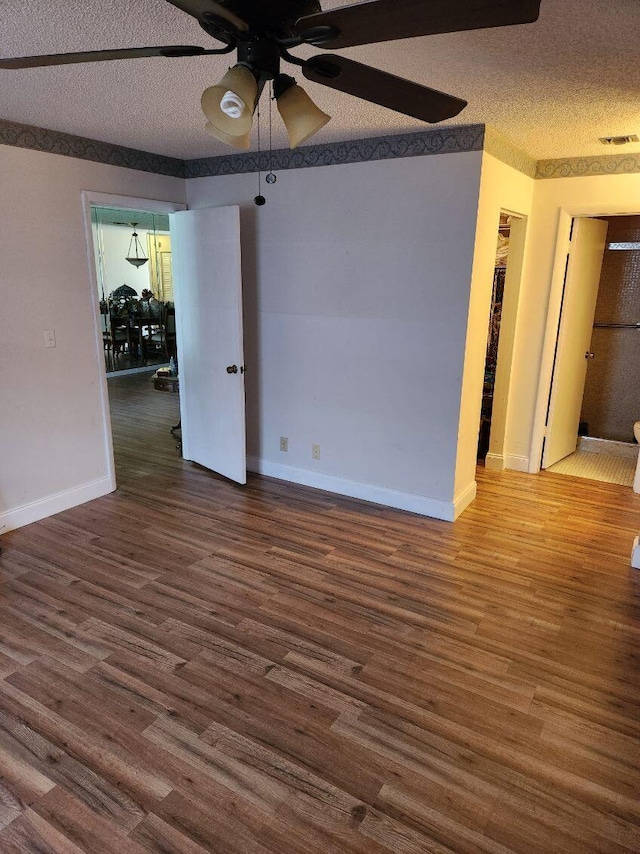 625 Pines Knoll Dr Unit B, Fort Pierce, FL 34982 - spare room featuring wood finished floors, a textured ceiling, ceiling fan, baseboards, and visible vents