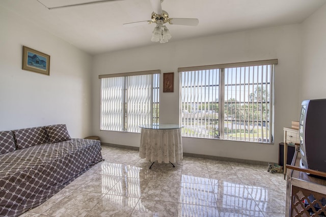 4281 NW 41st St Unit 320, Lauderdale Lakes, FL 33319 - living area featuring a ceiling fan and baseboards