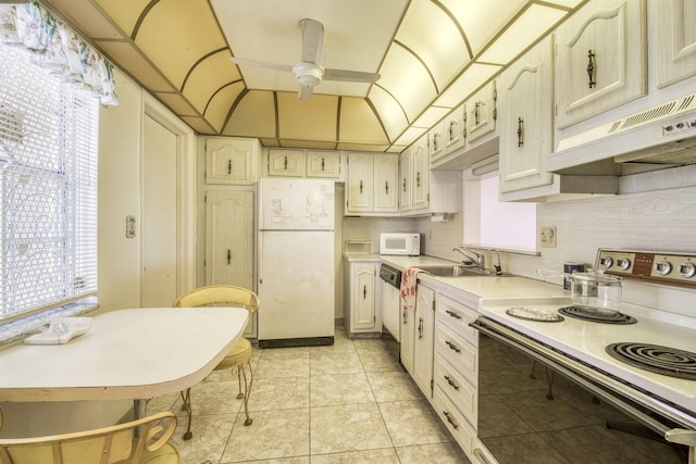 4281 NW 41st St Unit 320, Lauderdale Lakes, FL 33319 - kitchen with white appliances, a sink, ceiling fan, light countertops, and under cabinet range hood