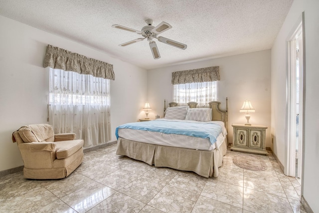 4281 NW 41st St Unit 320, Lauderdale Lakes, FL 33319 - bedroom with a textured ceiling, a ceiling fan, and light marble finish flooring