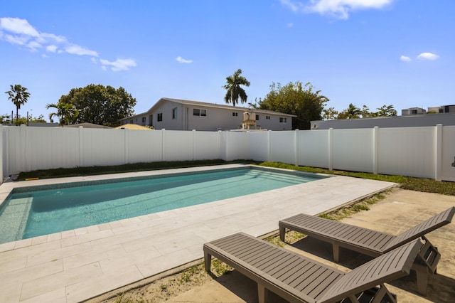 view of pool featuring a fenced backyard, a fenced in pool, and a patio