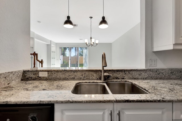 5797 Monterra Club Dr, Lake Worth, FL 33463 - kitchen featuring white cabinetry, light stone counters, and a sink