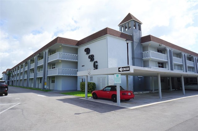 1040 SE 4th Ave Unit 222, Deerfield Beach, FL 33441 - view of building exterior with covered parking