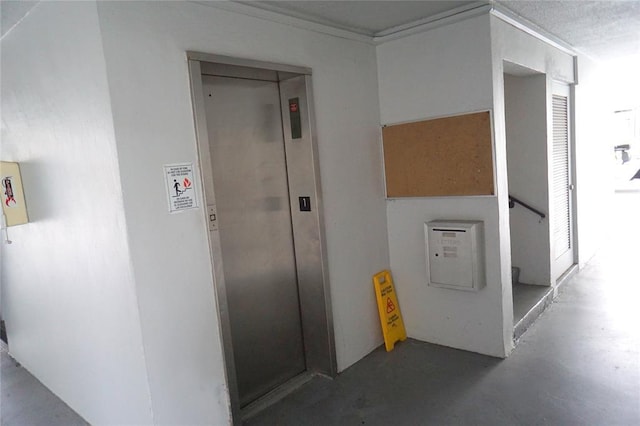 1040 SE 4th Ave Unit 222, Deerfield Beach, FL 33441 - corridor featuring elevator and concrete flooring