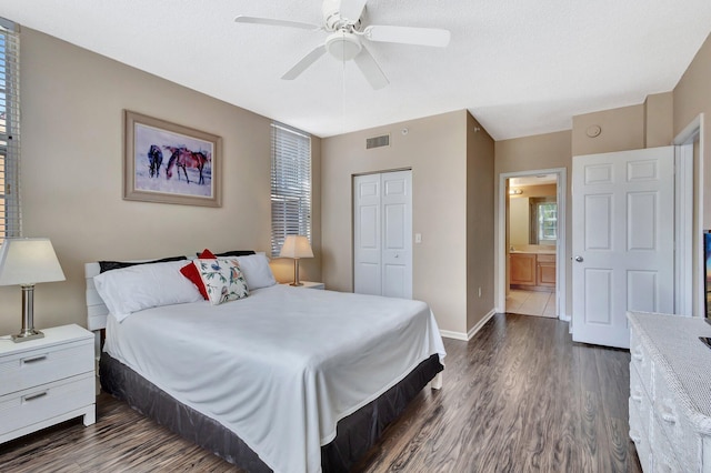 11760 Saint Andrews Pl Unit 204, Wellington, FL 33414 - bedroom featuring a closet, ceiling fan, dark wood finished floors, baseboards, and visible vents