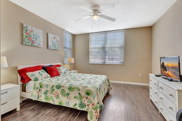 11760 Saint Andrews Pl Unit 204, Wellington, FL 33414 - bedroom with baseboards, a ceiling fan, wood finished floors, and a textured ceiling