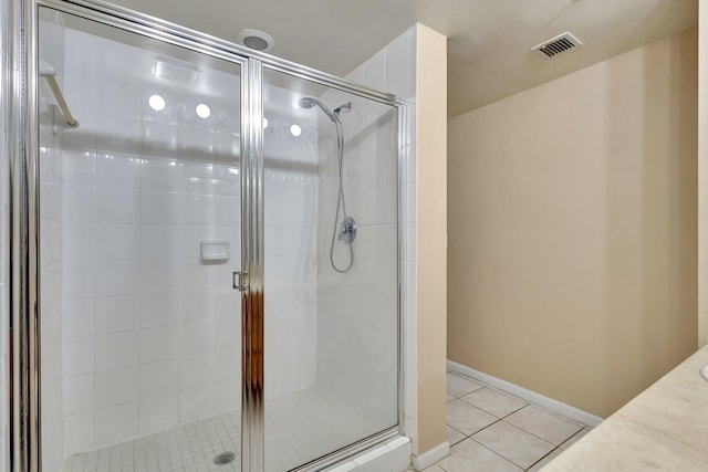 11760 Saint Andrews Pl Unit 204, Wellington, FL 33414 - bathroom with baseboards, visible vents, tile patterned flooring, and a stall shower