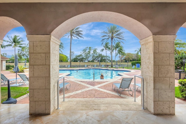 11760 Saint Andrews Pl Unit 204, Wellington, FL 33414 - community pool with a patio area