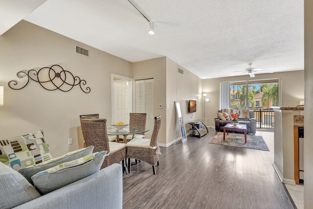 11760 Saint Andrews Pl Unit 204, Wellington, FL 33414 - living room with visible vents, baseboards, wood finished floors, and ceiling fan
