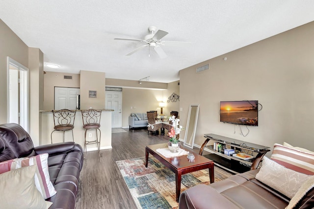 11760 Saint Andrews Pl Unit 204, Wellington, FL 33414 - living area featuring ceiling fan, baseboards, dark wood-type flooring, and visible vents