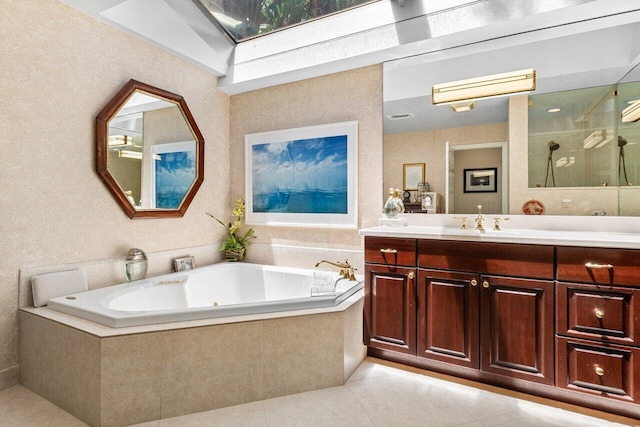full bath featuring vanity, tile patterned floors, a shower stall, and a garden tub