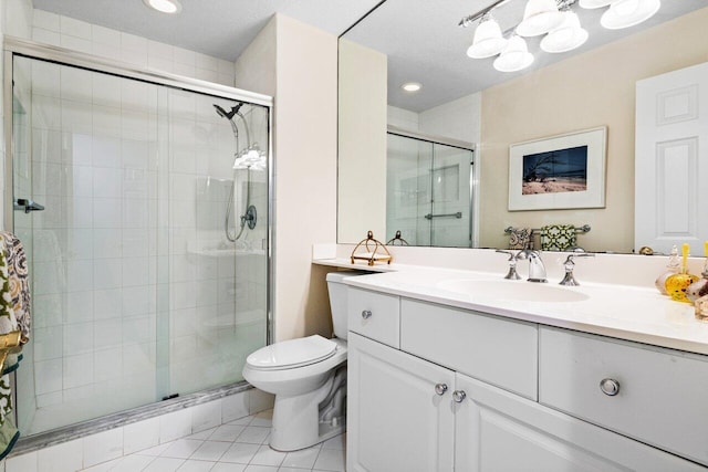 bathroom featuring a notable chandelier, vanity, toilet, tile patterned floors, and a stall shower