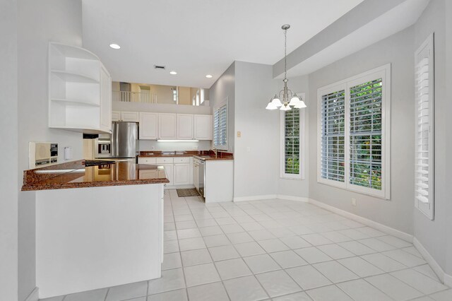 kitchen featuring baseboards, light tile patterned flooring, white cabinetry, open shelves, and appliances with stainless steel finishes