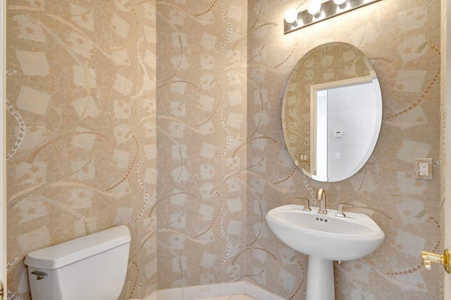 half bath featuring toilet
