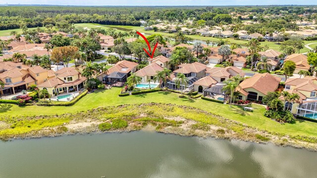 bird's eye view featuring a water view and a residential view