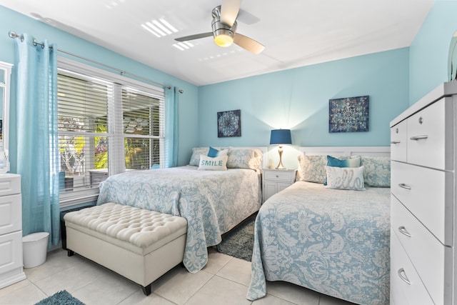 bedroom featuring a ceiling fan and light tile patterned floors