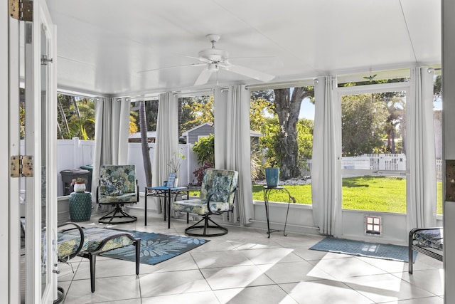 sunroom with plenty of natural light and tile patterned flooring