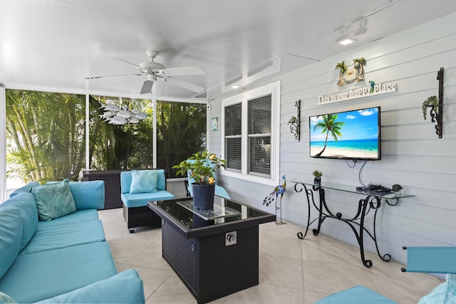 sunroom with an outdoor living space and ceiling fan