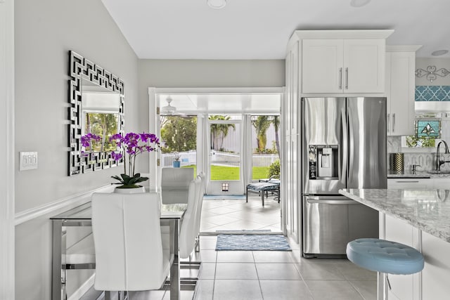 dining area featuring light tile patterned flooring