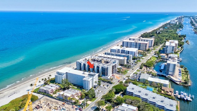 bird's eye view featuring a beach view and a water view