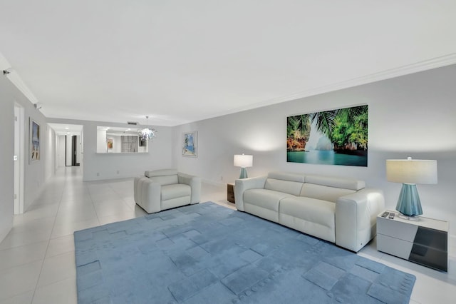 living area featuring baseboards, crown molding, and light tile patterned floors