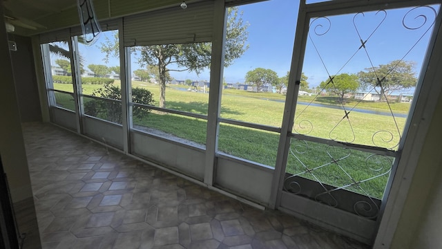 unfurnished sunroom with a residential view