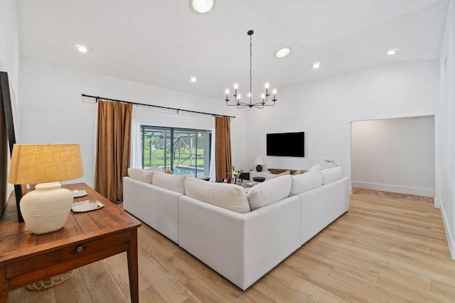 living area with baseboards, a chandelier, light wood finished floors, and recessed lighting
