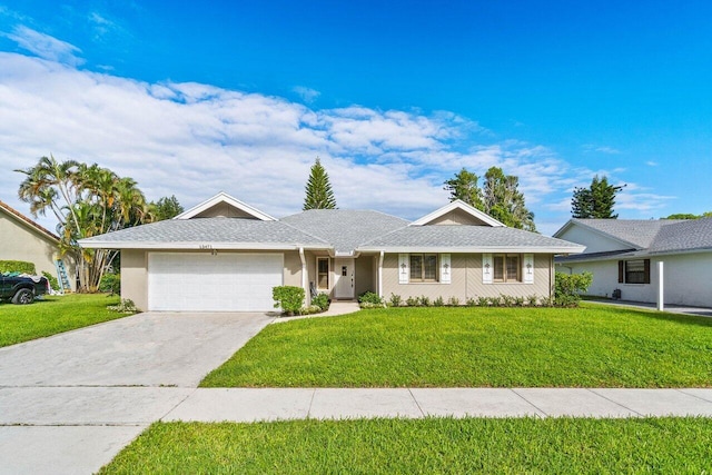 ranch-style home featuring an attached garage, driveway, a front lawn, and stucco siding