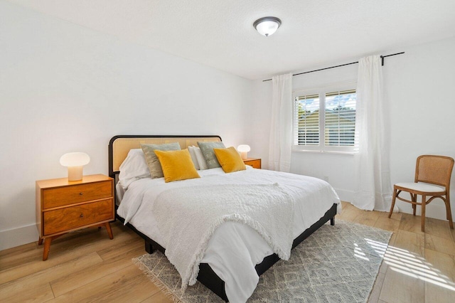 bedroom featuring light wood-style flooring