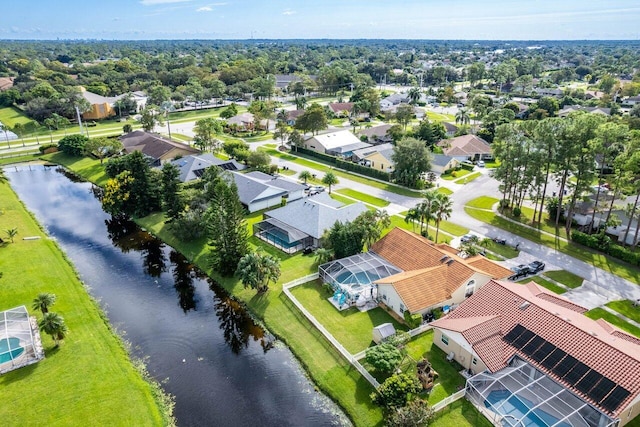 birds eye view of property featuring a residential view and a water view