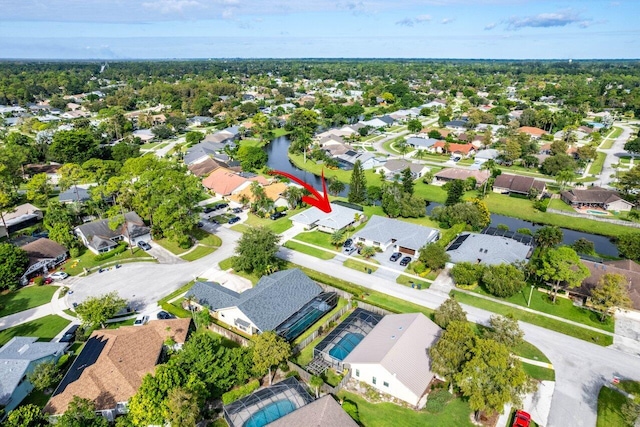 birds eye view of property with a residential view