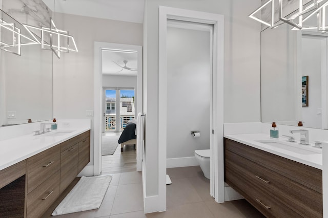 full bath featuring tile patterned flooring, toilet, vanity, and ensuite bath