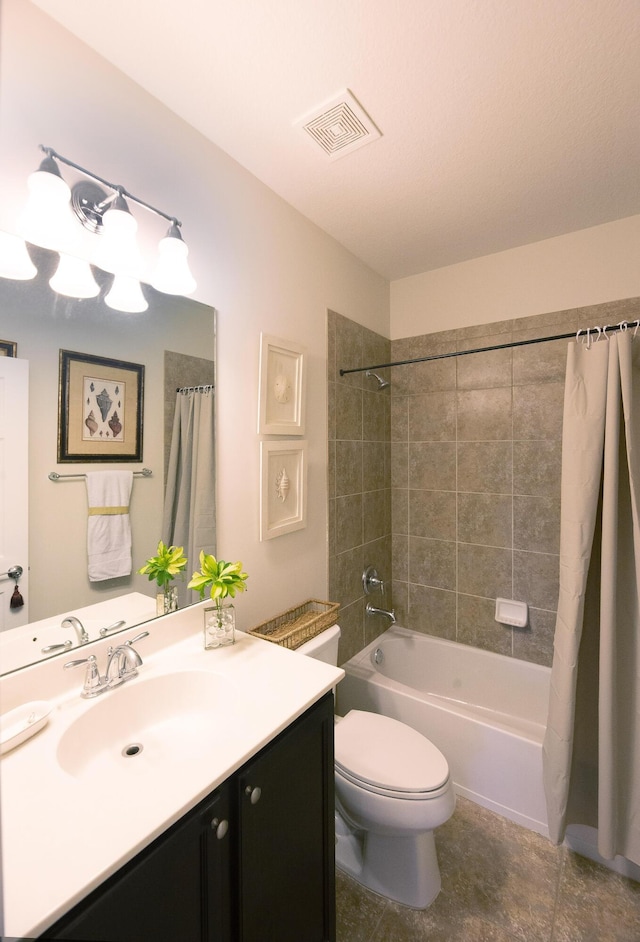 bathroom featuring toilet, vanity, shower / bathtub combination with curtain, and tile patterned flooring