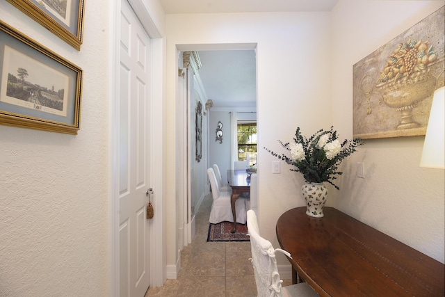 hallway with tile patterned floors