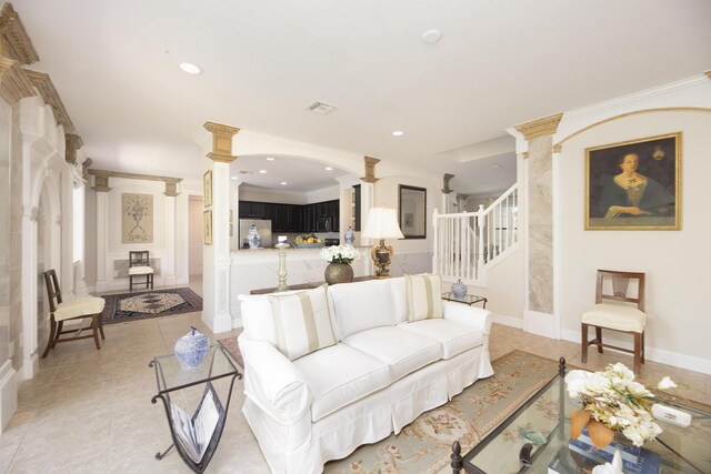 living room featuring ornate columns, stairs, recessed lighting, light tile patterned floors, and crown molding