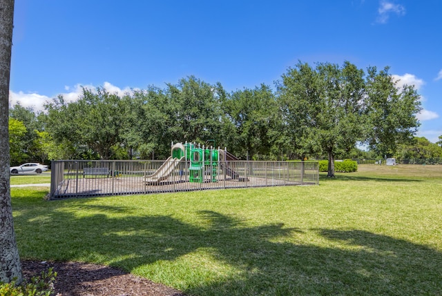communal playground featuring a yard