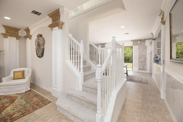 entrance foyer featuring stairway, ornate columns, recessed lighting, baseboards, and tile patterned flooring