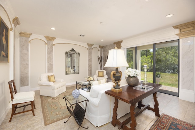 living area with ornate columns, recessed lighting, light tile patterned flooring, and baseboards