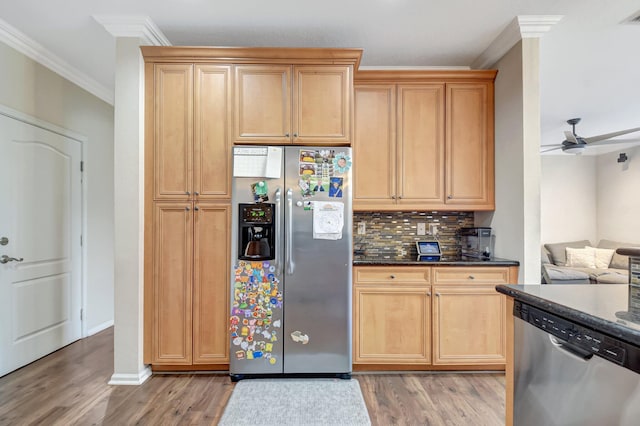 4721 N Prive Cir, Delray Beach, FL 33445 - kitchen featuring crown molding, decorative backsplash, ceiling fan, light wood-style flooring, and stainless steel appliances
