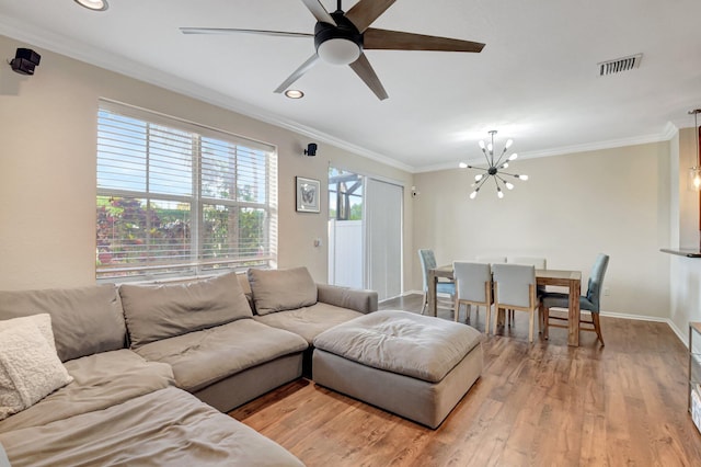 4721 N Prive Cir, Delray Beach, FL 33445 - living room with baseboards, visible vents, ornamental molding, and light wood finished floors