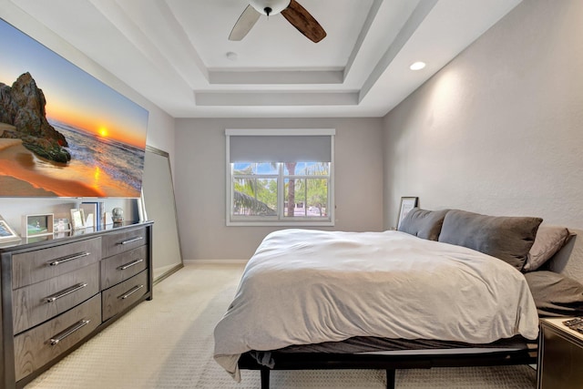 4721 N Prive Cir, Delray Beach, FL 33445 - bedroom featuring a ceiling fan, a tray ceiling, light carpet, and baseboards