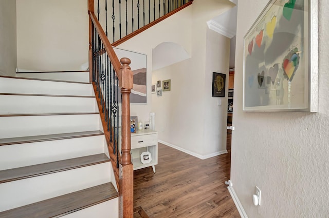 4721 N Prive Cir, Delray Beach, FL 33445 - unfurnished living room with arched walkways, a ceiling fan, ornamental molding, and baseboards