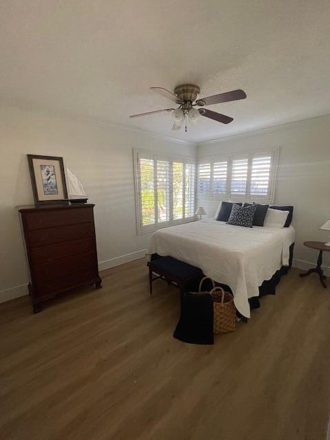 1028 SE 13th Ct, Deerfield Beach, FL 33441 - bedroom featuring baseboards, ceiling fan, ornamental molding, and wood finished floors