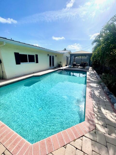 1028 SE 13th Ct, Deerfield Beach, FL 33441 - outdoor pool with a gazebo and a patio area