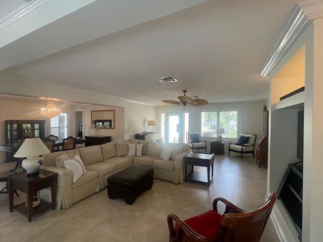 1028 SE 13th Ct, Deerfield Beach, FL 33441 - living area featuring visible vents and ceiling fan with notable chandelier
