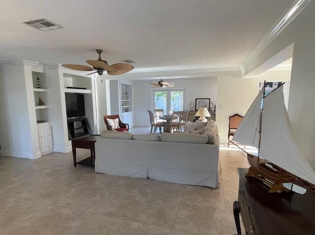 1028 SE 13th Ct, Deerfield Beach, FL 33441 - living area featuring crown molding, built in features, a ceiling fan, and visible vents