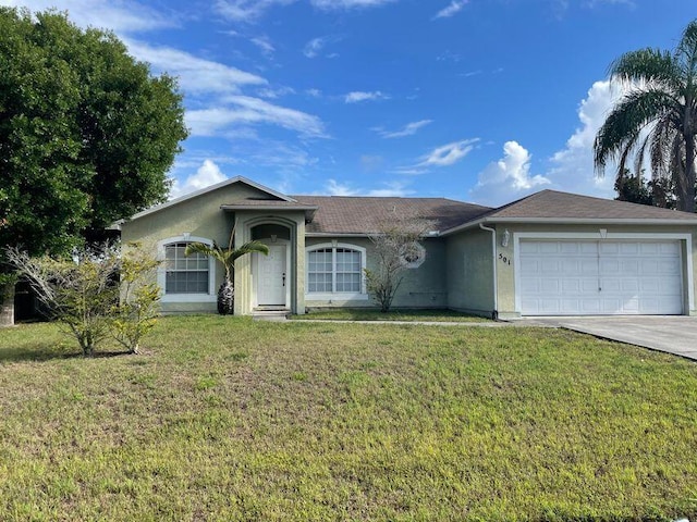 501 SE Sweet Ave, Port Saint Lucie, FL 34983 - ranch-style house featuring stucco siding, an attached garage, driveway, and a front yard