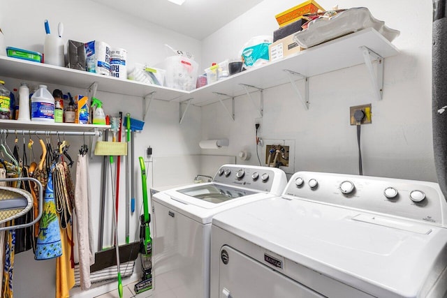 washroom featuring independent washer and dryer and laundry area