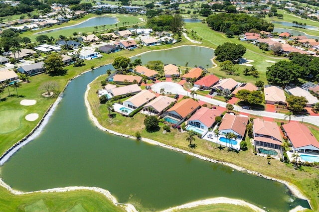 bird's eye view with view of golf course, a water view, and a residential view
