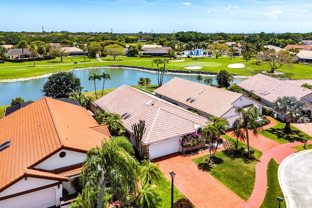 birds eye view of property with golf course view, a residential view, and a water view